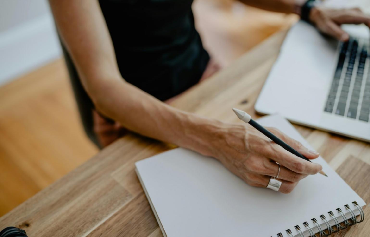 Professional reviewing business metrics on computer screen